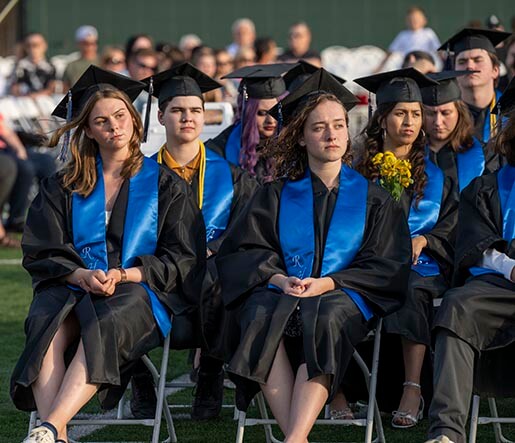 River HomeLink graduates listen intently during their commencement ceremony